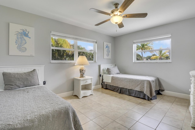 bedroom featuring light tile patterned floors and ceiling fan