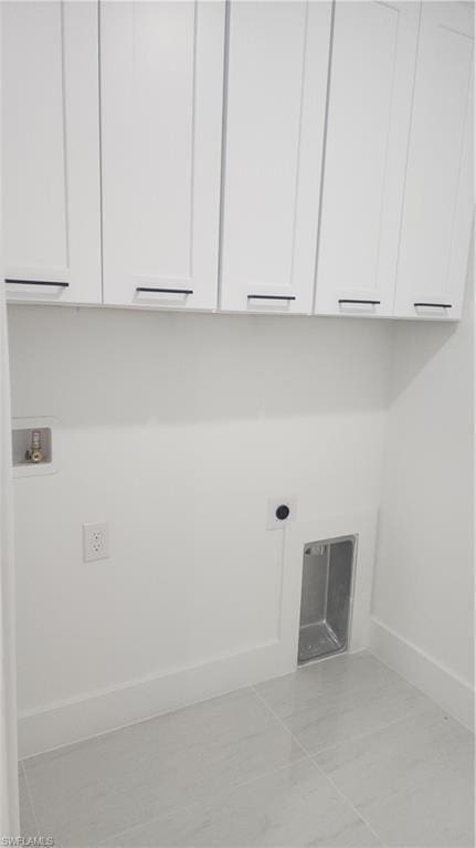 laundry room featuring cabinets, electric dryer hookup, and hookup for a washing machine