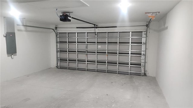 garage featuring electric panel and a garage door opener