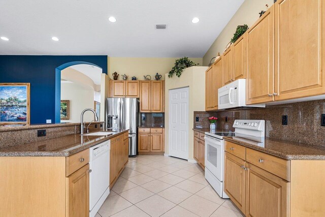 7357 Marbella Echo Dr, Delray Beach, FL 33446 - kitchen with sink, white appliances, dark stone countertops, and light tile patterned floors