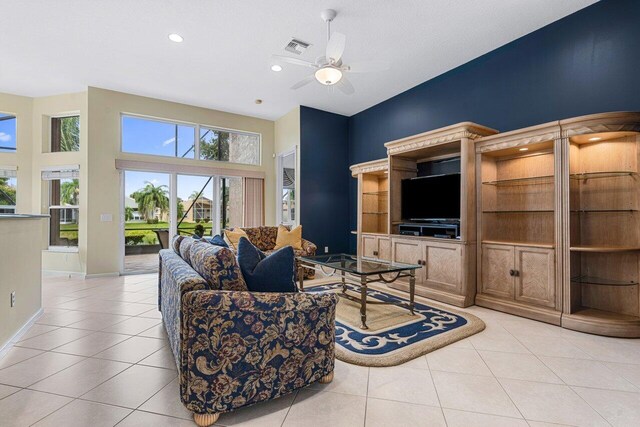 7357 Marbella Echo Dr, Delray Beach, FL 33446 - living room featuring light tile patterned floors, ceiling fan, and a towering ceiling
