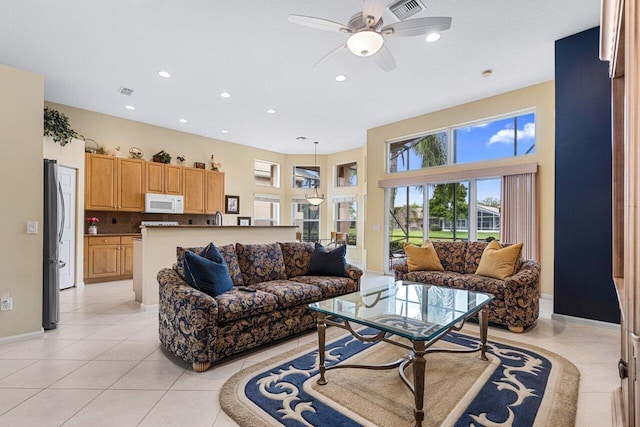 7357 Marbella Echo Dr, Delray Beach, FL 33446 - living room with light tile patterned flooring and ceiling fan