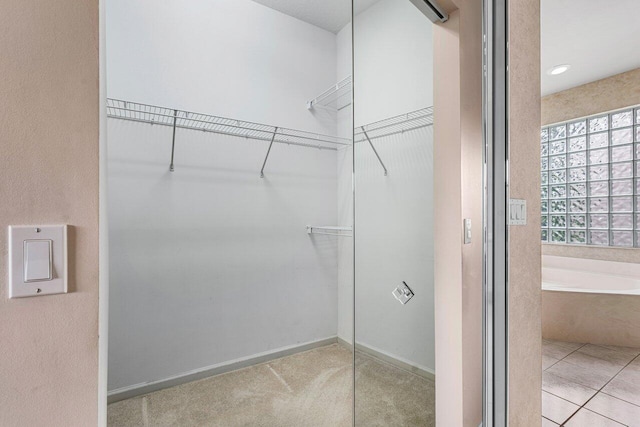 7357 Marbella Echo Dr, Delray Beach, FL 33446 - walk in closet with light tile patterned floors