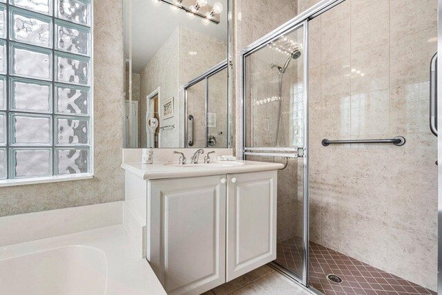 7357 Marbella Echo Dr, Delray Beach, FL 33446 - bathroom featuring vanity, tile patterned flooring, and an enclosed shower