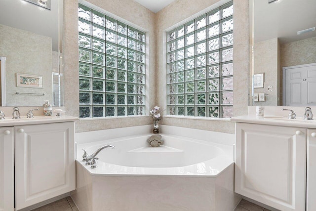 7357 Marbella Echo Dr, Delray Beach, FL 33446 - bathroom with a tub, vanity, and tile patterned flooring