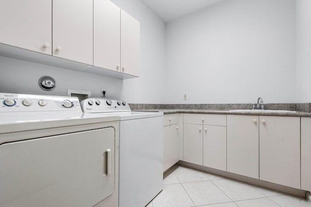 7357 Marbella Echo Dr, Delray Beach, FL 33446 - washroom with sink, cabinets, independent washer and dryer, and light tile patterned floors