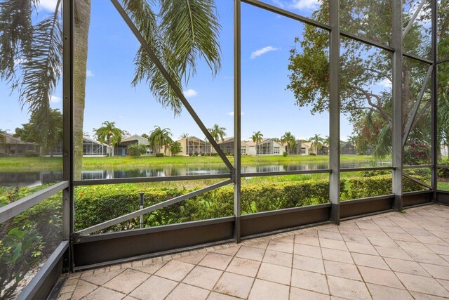 7357 Marbella Echo Dr, Delray Beach, FL 33446 - unfurnished sunroom with a water view