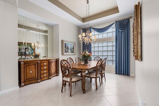 7357 Marbella Echo Dr, Delray Beach, FL 33446 - dining room featuring light tile patterned floors, a chandelier, and a raised ceiling