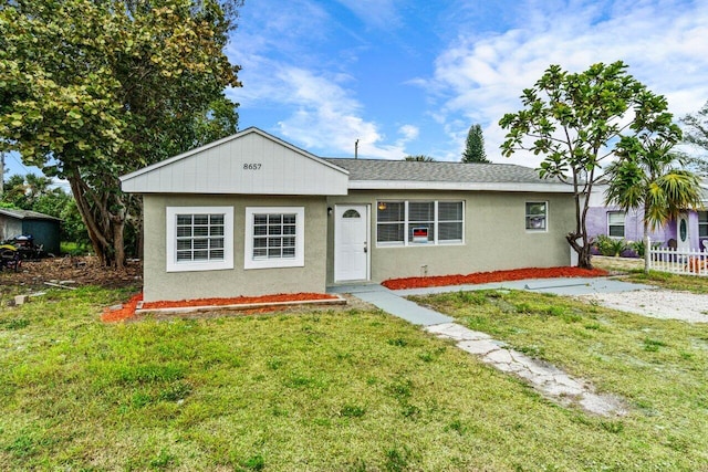 ranch-style house with a front yard