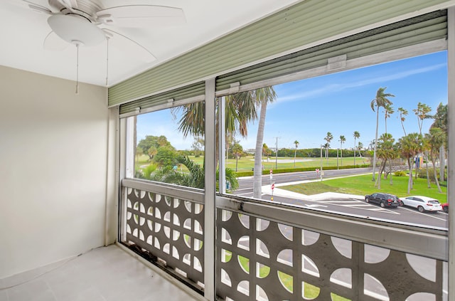 sunroom / solarium with ceiling fan