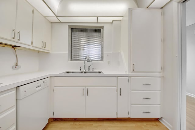 kitchen with sink, light hardwood / wood-style flooring, white cabinets, and dishwasher