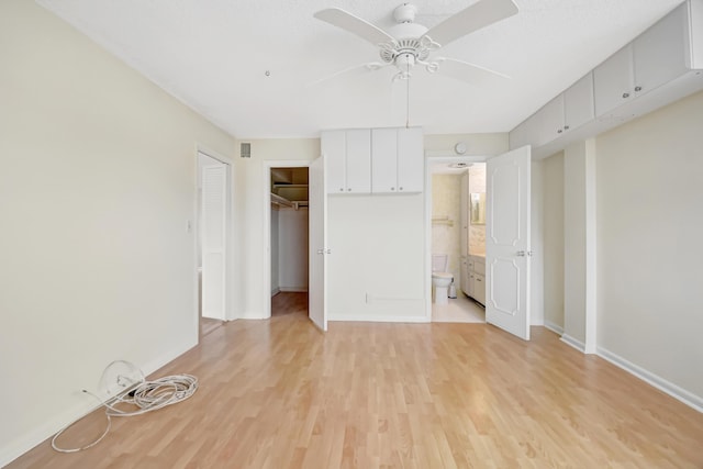 unfurnished bedroom featuring ceiling fan and light wood-type flooring