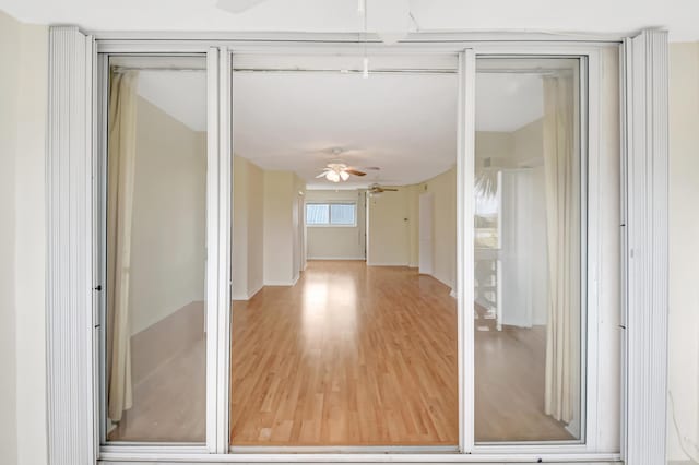 interior space with ceiling fan and hardwood / wood-style floors