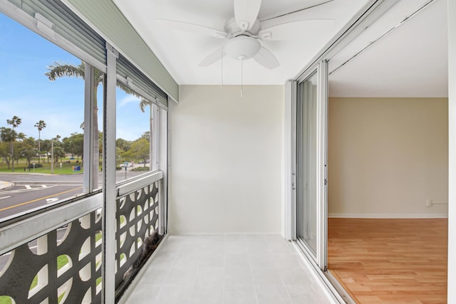 sunroom / solarium with ceiling fan