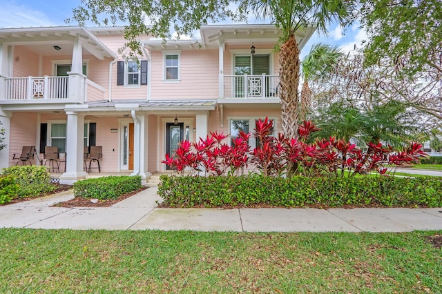 townhome / multi-family property featuring a porch