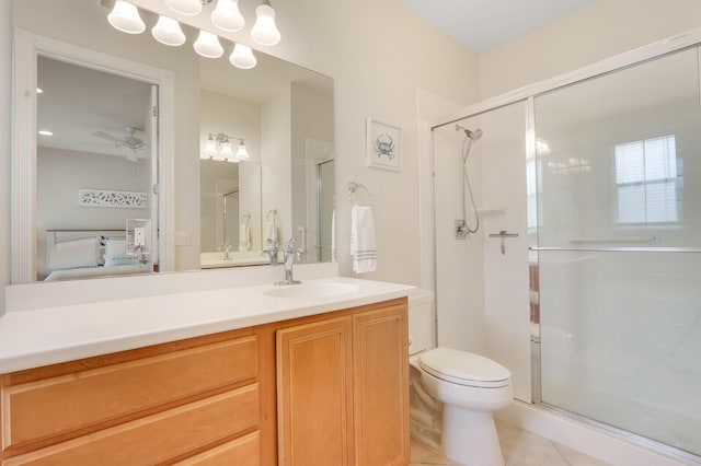 ensuite bathroom featuring a stall shower, a ceiling fan, and connected bathroom