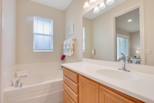 bathroom featuring a bath and vanity