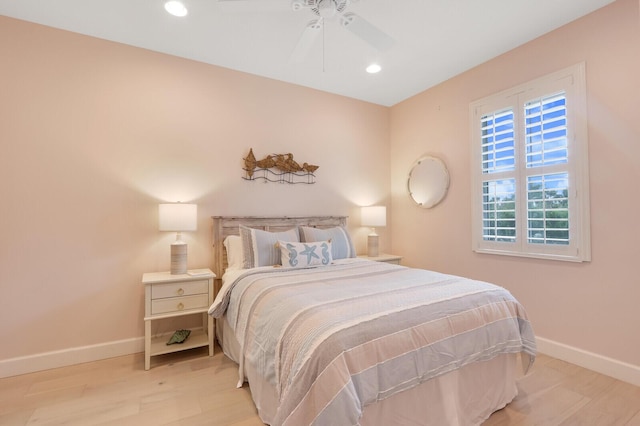 bedroom featuring ceiling fan, light wood-style floors, recessed lighting, and baseboards