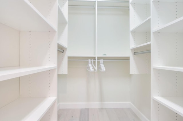 spacious closet with wood finished floors