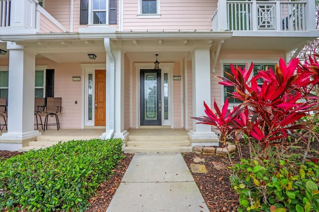 doorway to property featuring covered porch