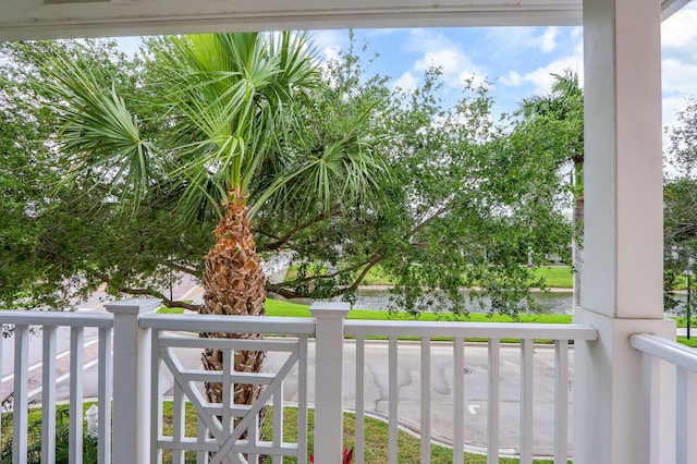 balcony featuring a water view