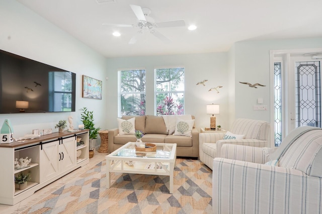 living area with a ceiling fan and recessed lighting