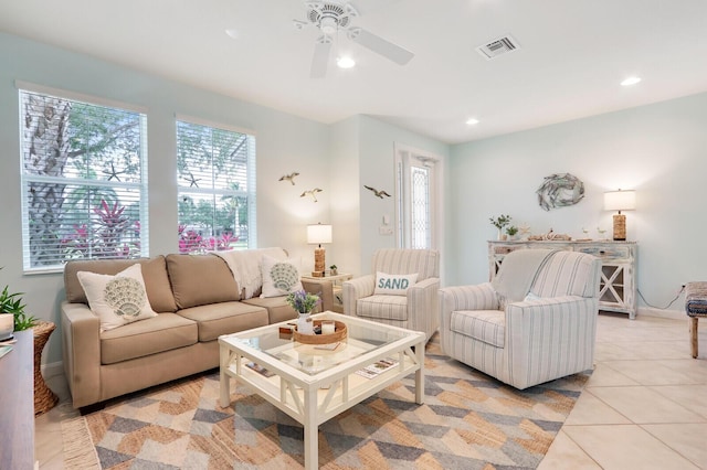 living room featuring light tile patterned floors, a ceiling fan, visible vents, and recessed lighting