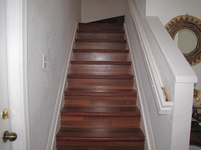 stairs with a textured wall
