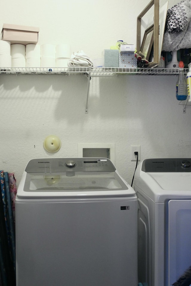 laundry area featuring laundry area and washer and dryer