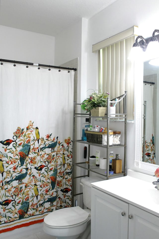 full bath featuring toilet and vanity
