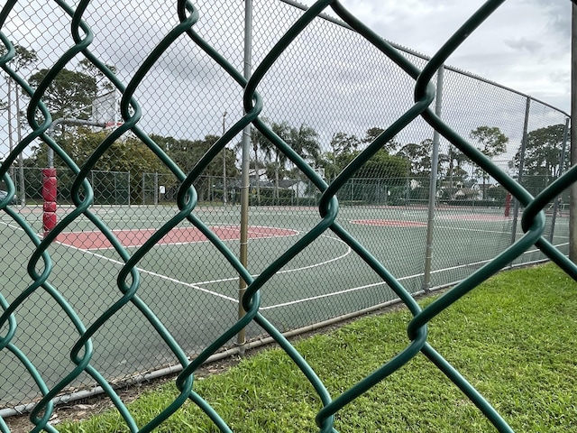 view of sport court with fence