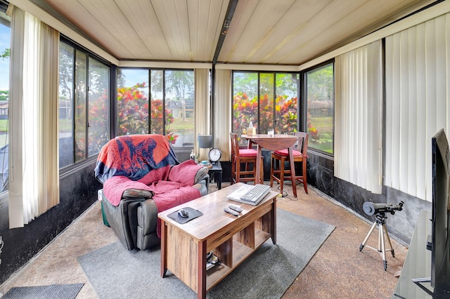 sunroom / solarium featuring wooden ceiling and plenty of natural light