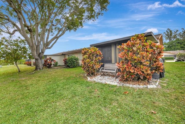 view of front of home with a front lawn