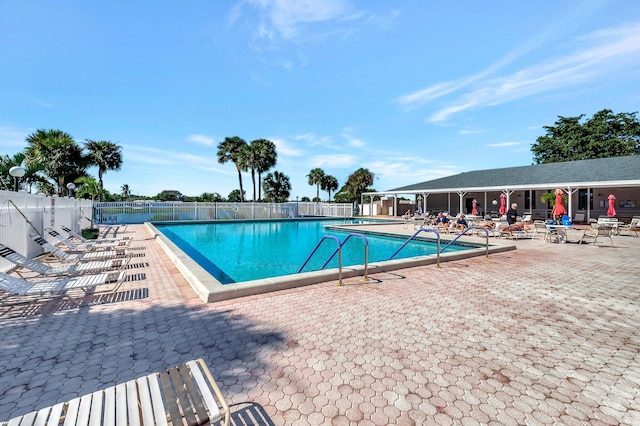 view of swimming pool with a patio area