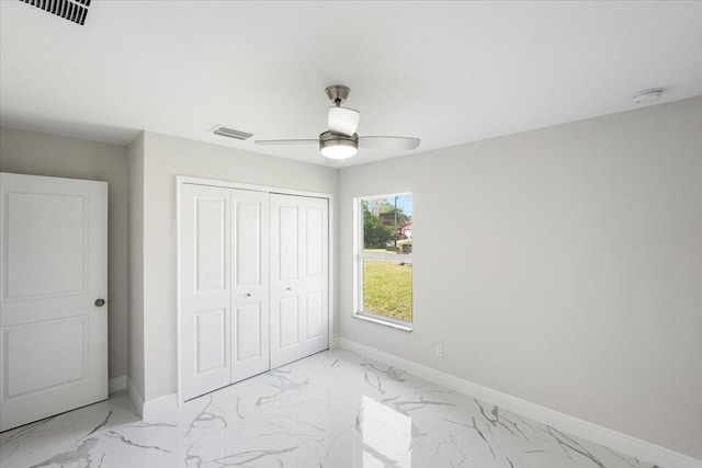 bedroom featuring ceiling fan and a closet