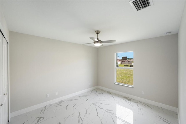 unfurnished room with ceiling fan