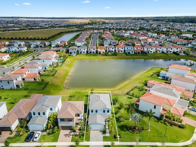 aerial view with a water view and a residential view