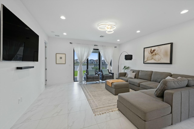 living room featuring baseboards, marble finish floor, visible vents, and recessed lighting