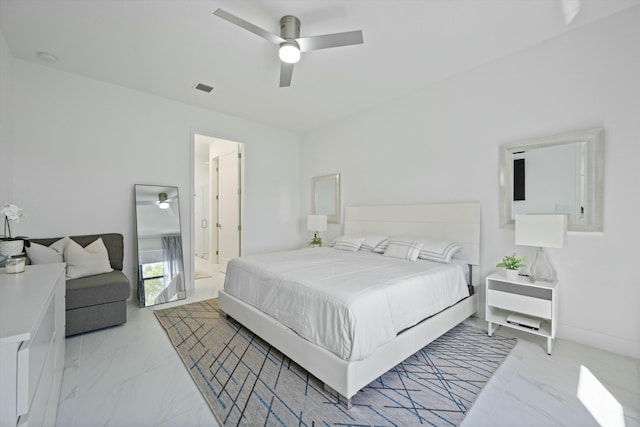 bedroom with ceiling fan, marble finish floor, ensuite bath, and visible vents