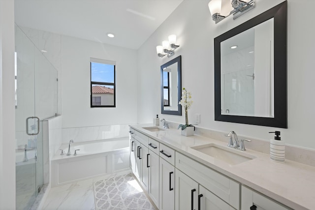 bathroom with double vanity, a sink, a bath, and a shower stall