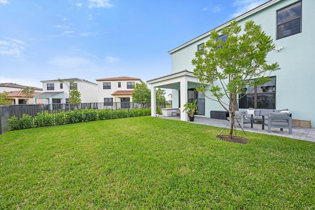 view of yard featuring a patio area, a fenced backyard, a residential view, and an outdoor hangout area