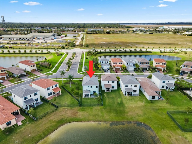 aerial view with a water view and a residential view