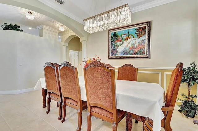 dining room featuring light tile patterned flooring and ornamental molding