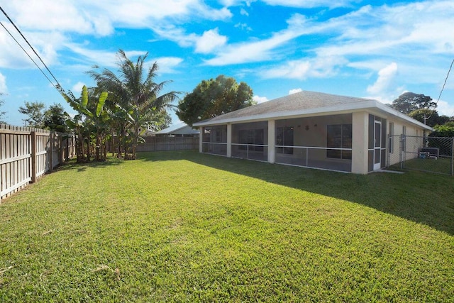 view of yard with a sunroom