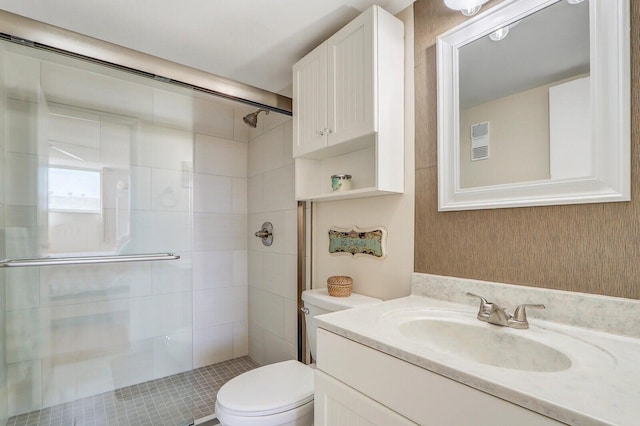 full bath with toilet, a shower stall, visible vents, and vanity