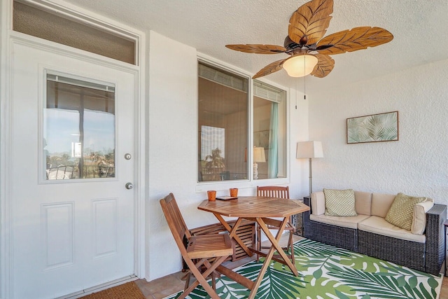 interior space with ceiling fan and an outdoor living space