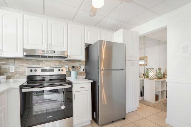 kitchen featuring stainless steel appliances, backsplash, white cabinets, and under cabinet range hood