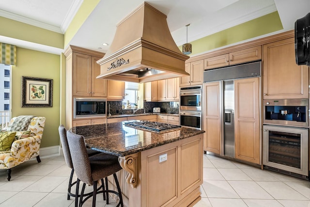 kitchen featuring built in appliances, beverage cooler, ornamental molding, custom range hood, and light tile patterned flooring