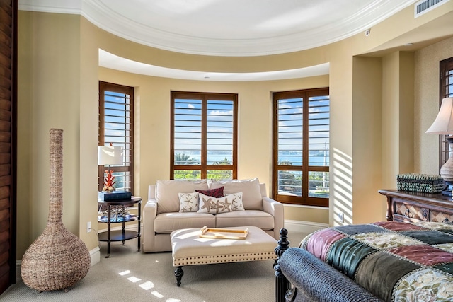 carpeted bedroom featuring ornamental molding and baseboards