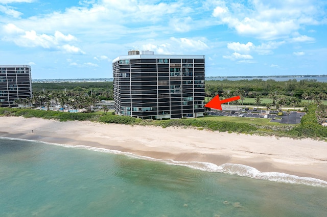 bird's eye view featuring a beach view and a water view